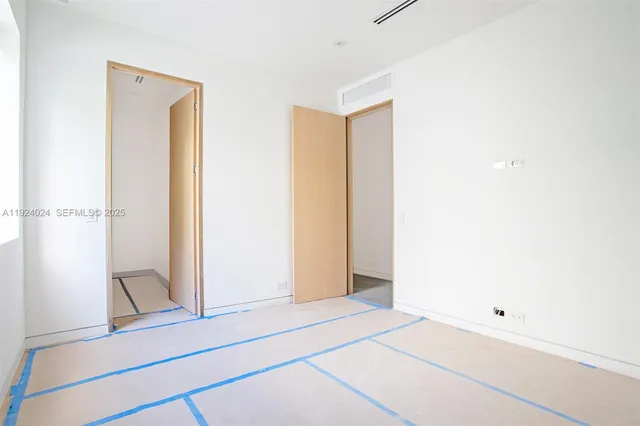 a view of an empty room with stairs