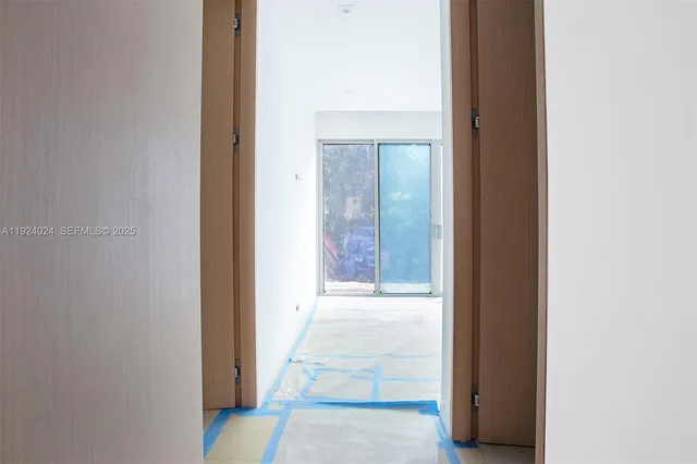 a view of an empty room with a balcony
