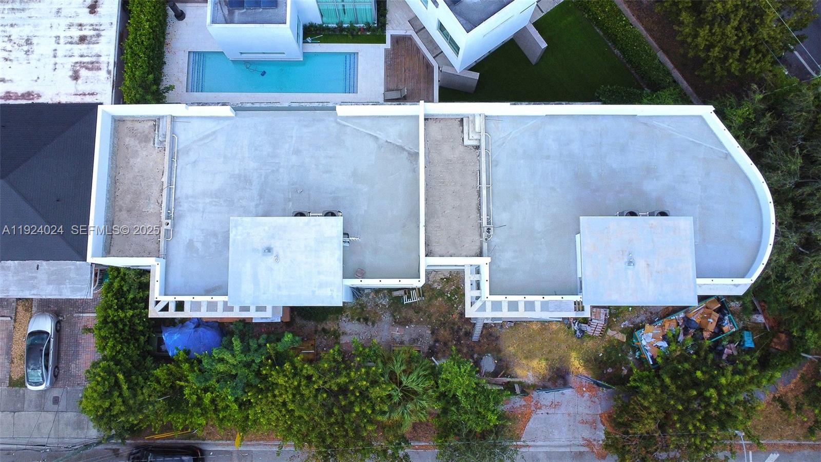 1105 Southwest 22nd Terrace Miami, FL 33129 - Photo 56 of 56 an aerial view of residential houses with outdoor space and a car parked