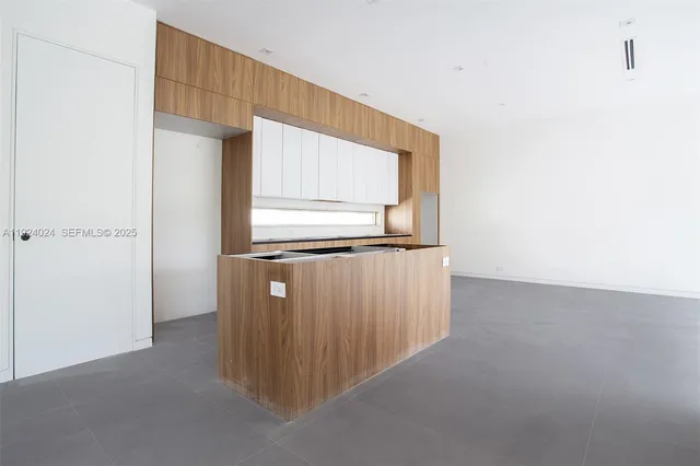 a view of room and hardwood floor