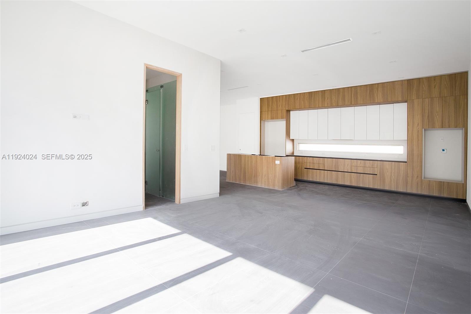 1105 Southwest 22nd Terrace Miami, FL 33129 - Photo 10 of 56 a view of room and hardwood floor