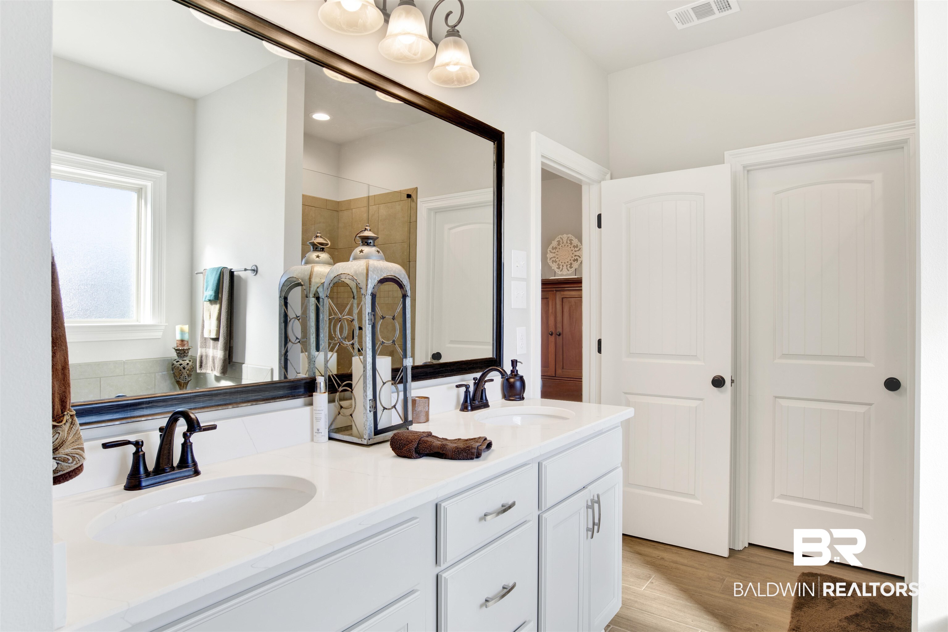 1406 Aldon Street Foley, AL 36535 - Photo 26 of 30 Bathroom with vanity, luxury wood-like tile flooring and separate tub and walk in shower