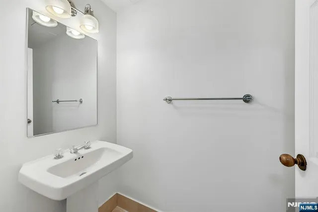 a bathroom with a sink and mirror
