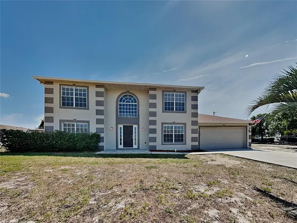 front view of a house with a yard