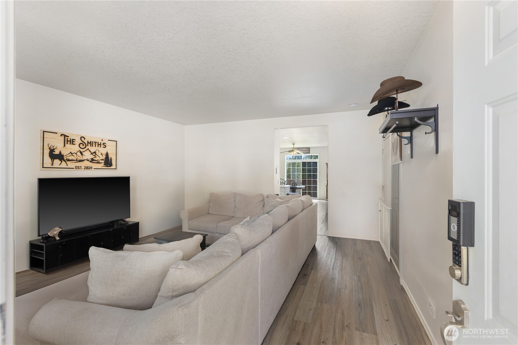 8305 Sweetbrier Loop Southeast Olympia, WA 98513 - Photo 11 of 40 a living room with furniture and a flat screen tv