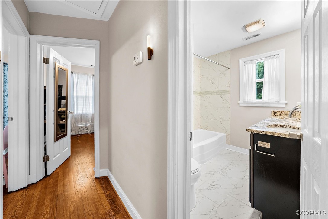4444 Cogbill Road Richmond, VA 23234 - Photo 14 of 32 Hallway featuring a sink, baseboards, and marble l