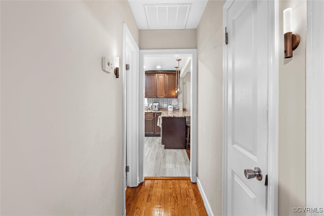 4444 Cogbill Road Richmond, VA 23234 - Photo 15 of 32 Hallway featuring light wood-style flooring and ba