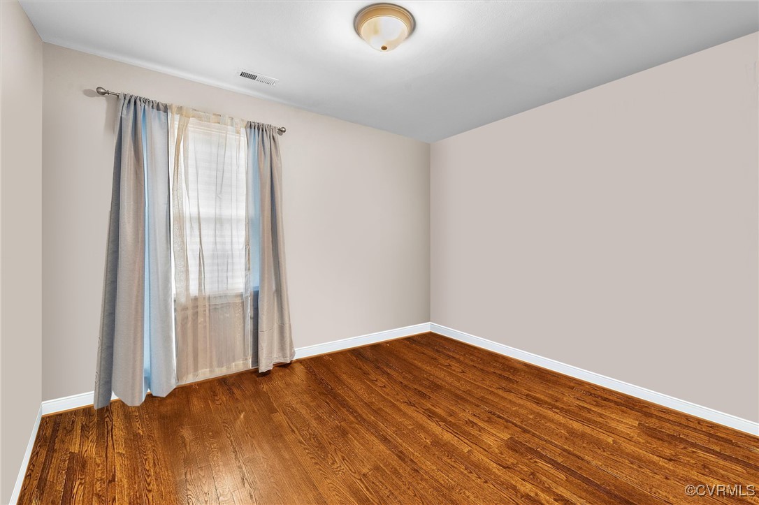 4444 Cogbill Road Richmond, VA 23234 - Photo 18 of 32 Unfurnished room with dark wood-style floors and b