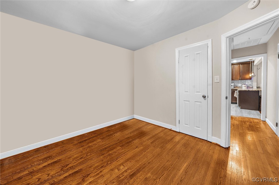 4444 Cogbill Road Richmond, VA 23234 - Photo 19 of 32 Unfurnished room with wood finished floors, a smok