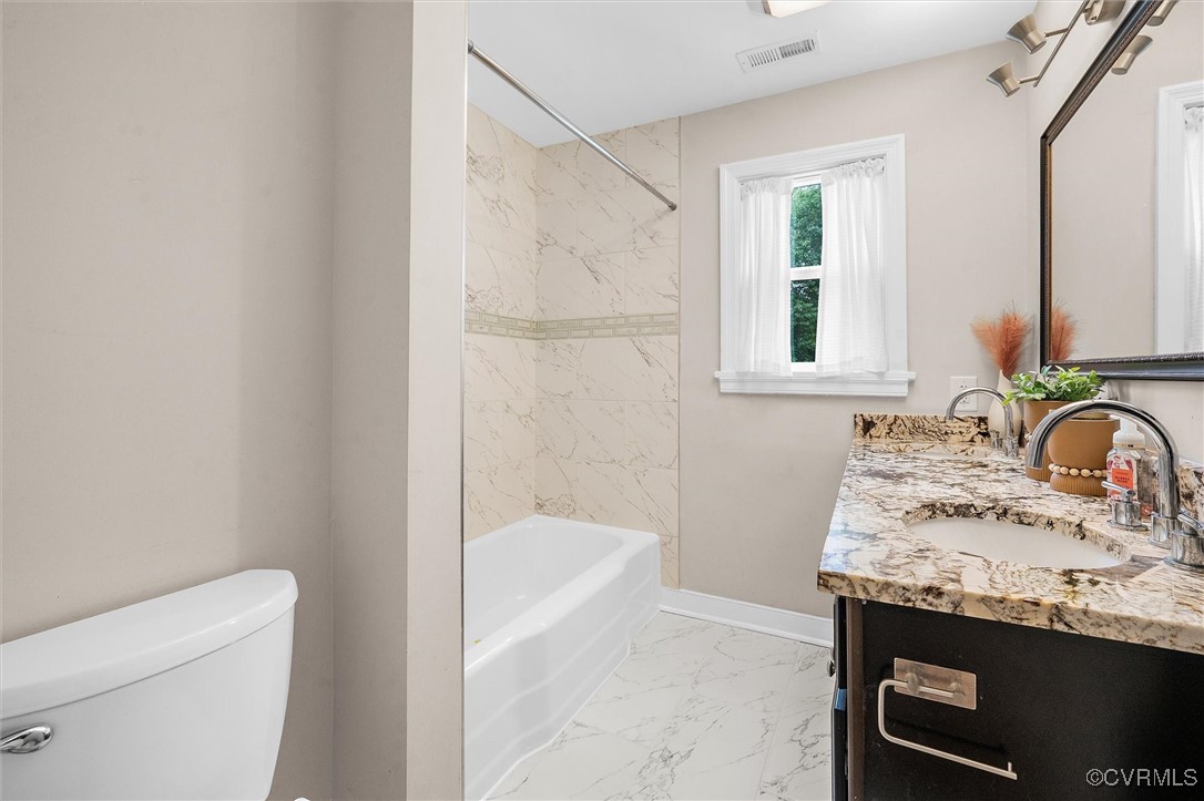 4444 Cogbill Road Richmond, VA 23234 - Photo 20 of 32 Bathroom featuring marble look tiles, toilet, doub