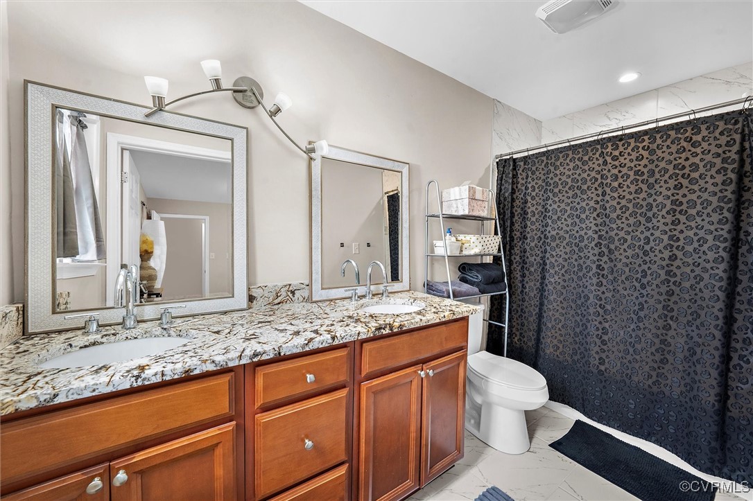 4444 Cogbill Road Richmond, VA 23234 - Photo 24 of 32 Bathroom featuring marble look tiles, toilet, doub