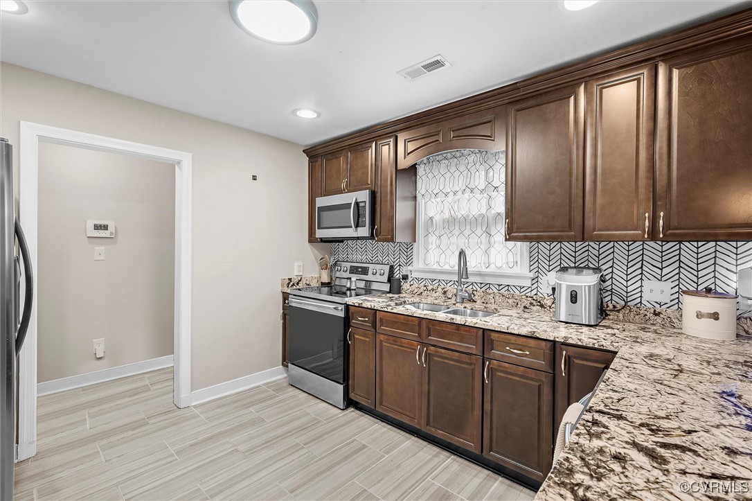 4444 Cogbill Road Richmond, VA 23234 - Photo 10 of 32 Kitchen featuring stainless steel appliances, a si