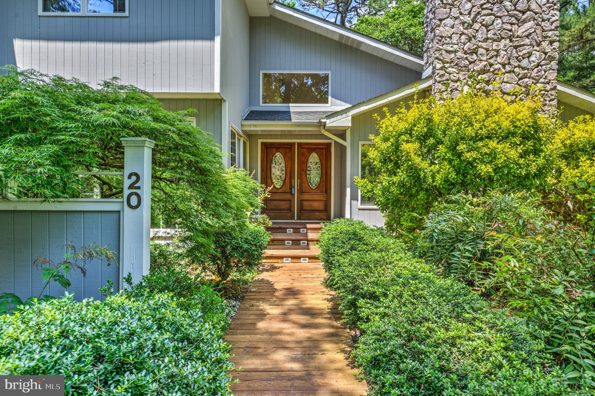 20 Woodbrook Road Voorhees, NJ 08043 - Photo 1 of 46 a front view of a house with garden