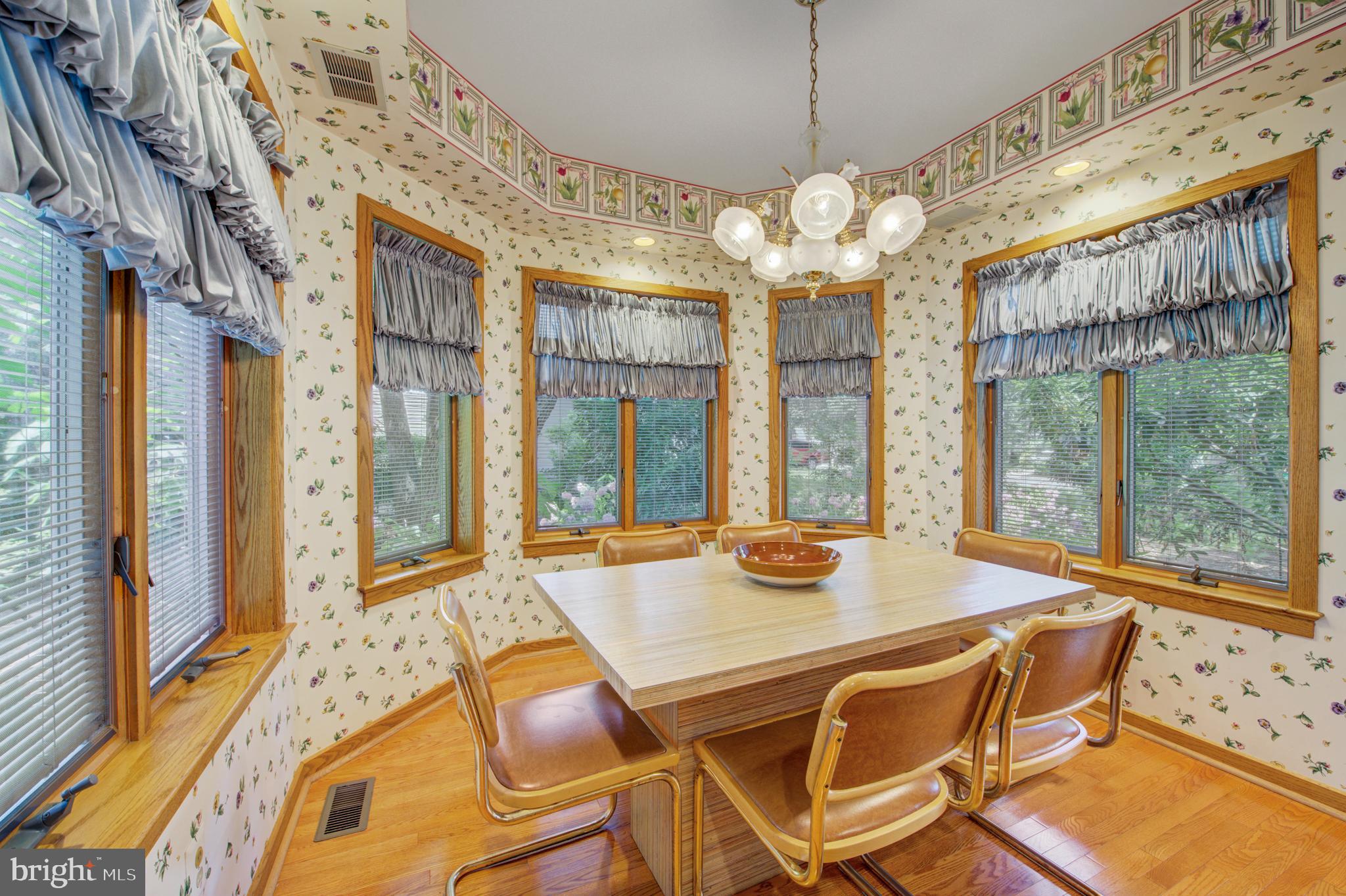 20 Woodbrook Road Voorhees, NJ 08043 - Photo 13 of 46 a view of a dining room with furniture a chandelier and large windows