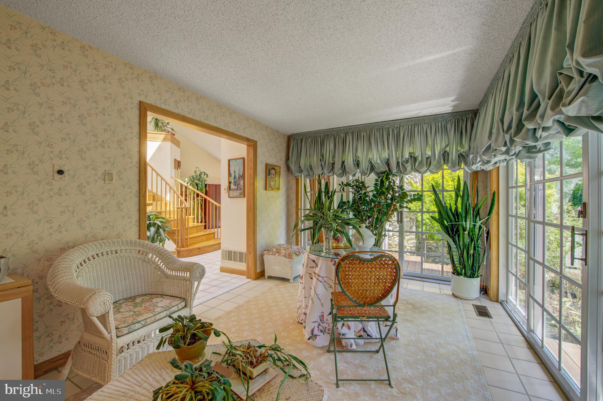 20 Woodbrook Road Voorhees, NJ 08043 - Photo 19 of 46 a living room with furniture and a large window