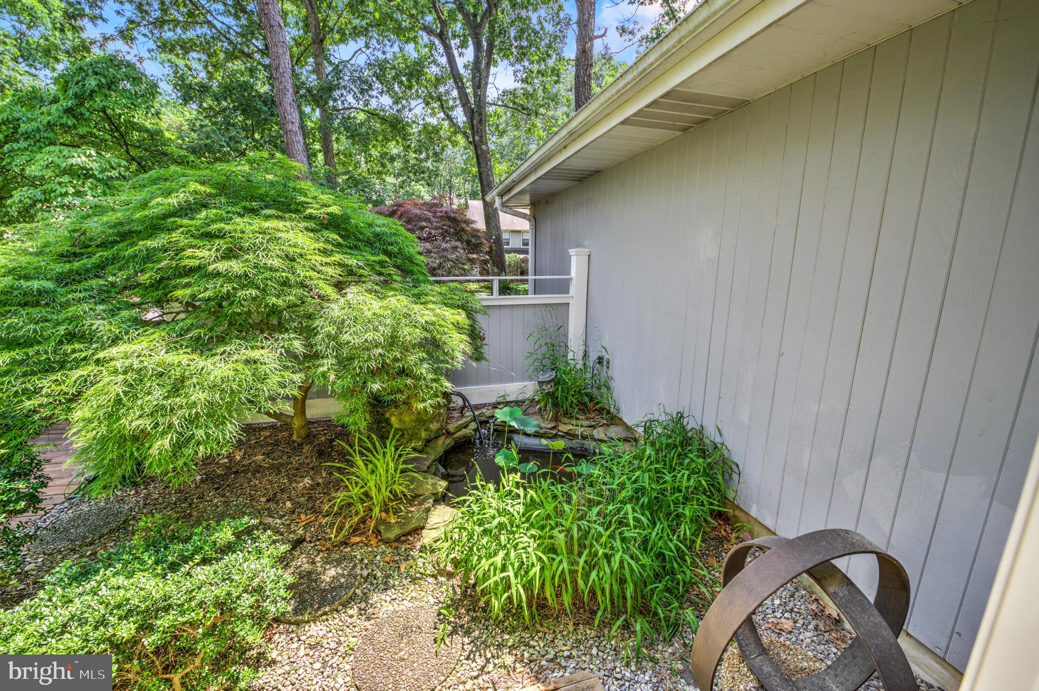 20 Woodbrook Road Voorhees, NJ 08043 - Photo 20 of 46 a backyard of a house with lots of green space