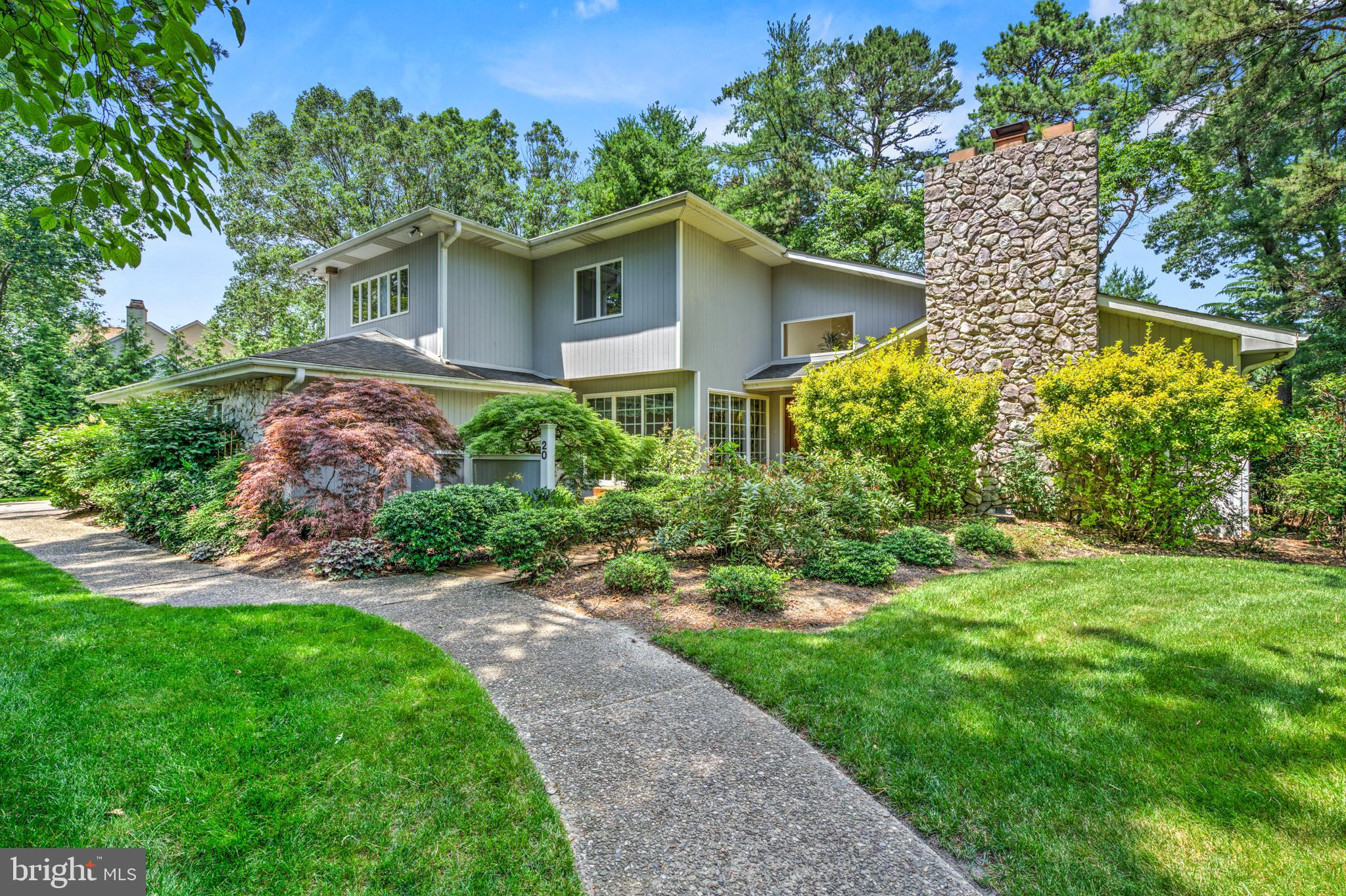 20 Woodbrook Road Voorhees, NJ 08043 - Photo 2 of 46 a view of a house with a yard and potted plants