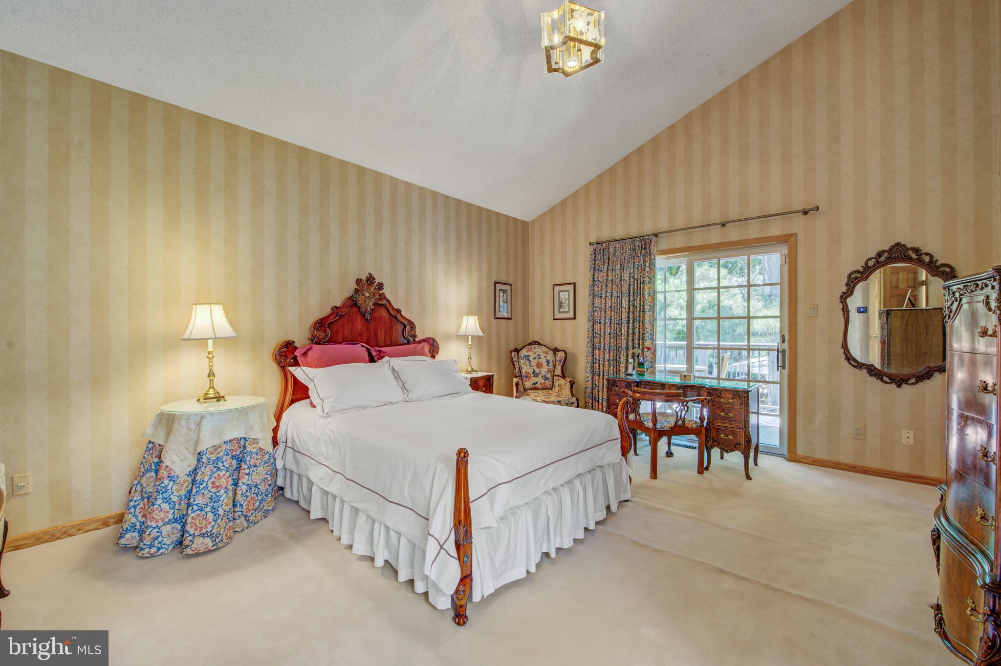 20 Woodbrook Road Voorhees, NJ 08043 - Photo 22 of 46 a spacious bedroom with a bed and a table