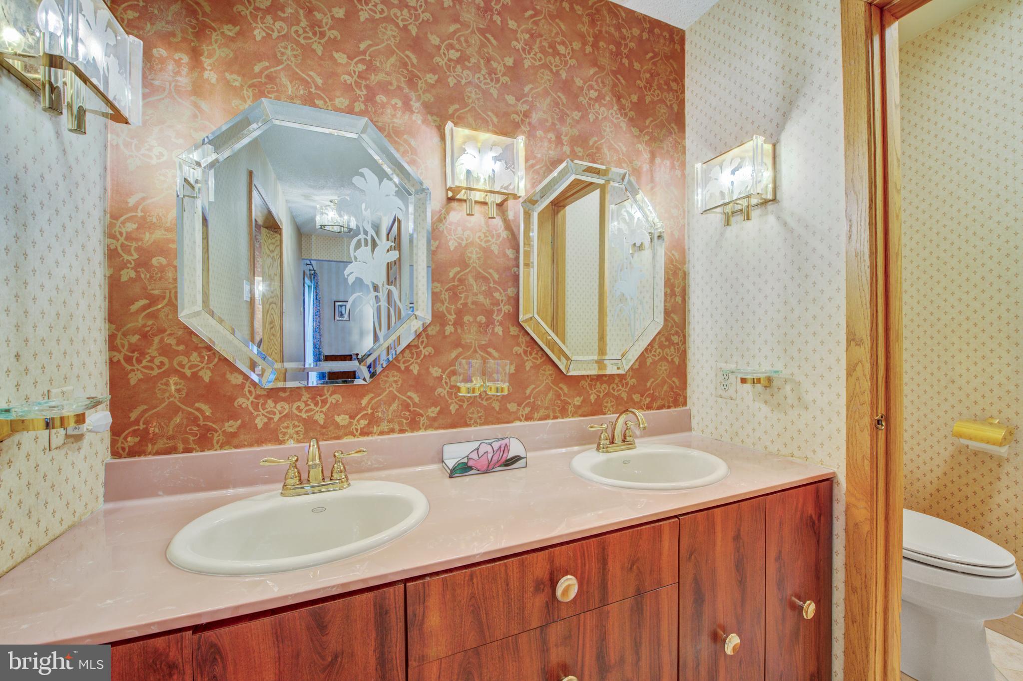 20 Woodbrook Road Voorhees, NJ 08043 - Photo 27 of 46 a bathroom with a double vanity sink and a mirror