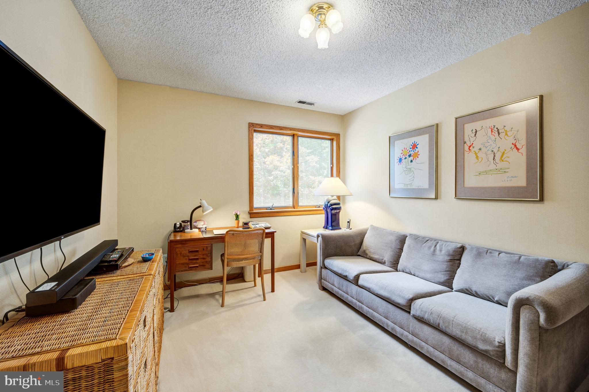 20 Woodbrook Road Voorhees, NJ 08043 - Photo 29 of 46 a living room with furniture and a flat screen tv