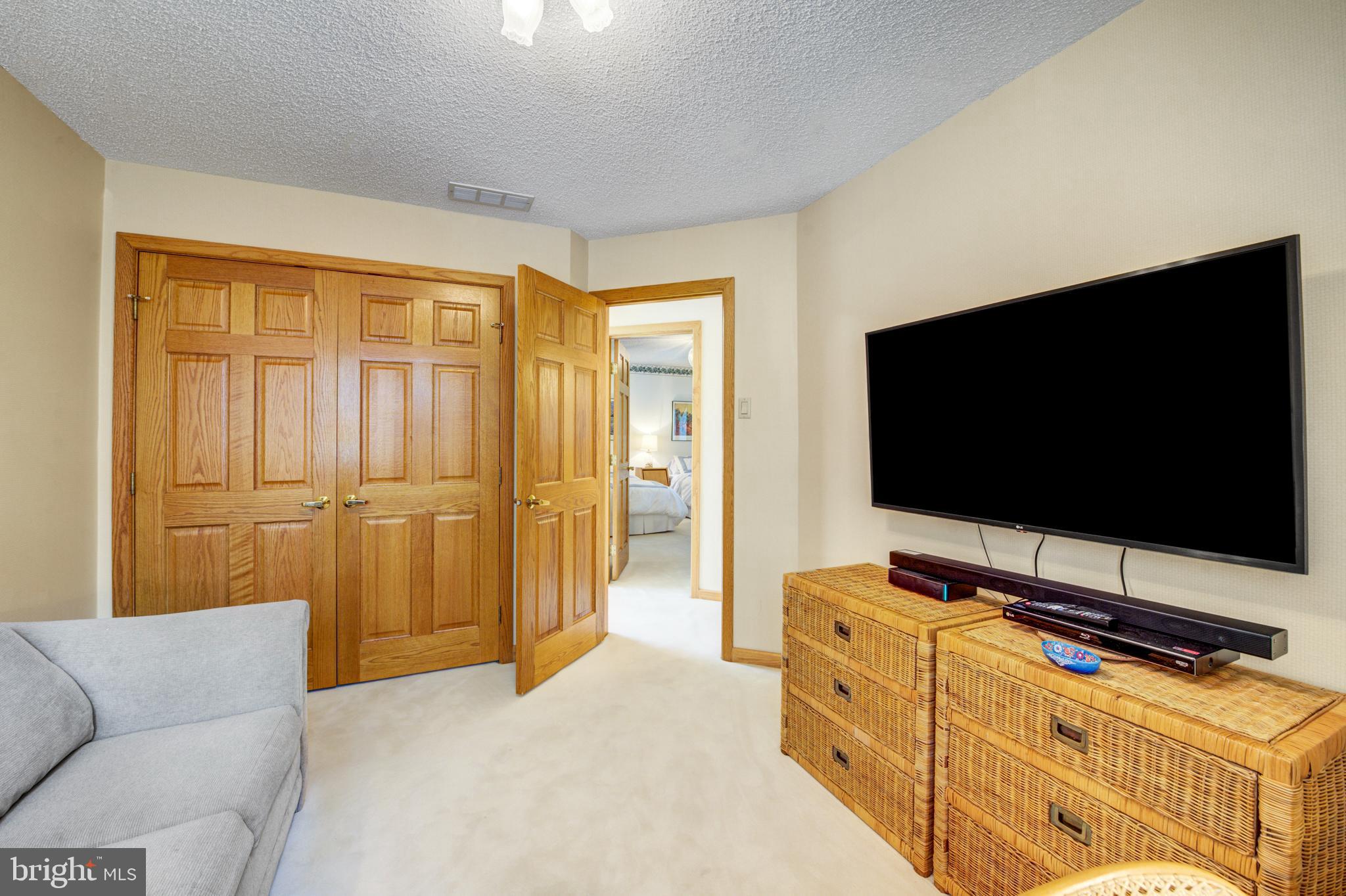 20 Woodbrook Road Voorhees, NJ 08043 - Photo 30 of 46 a living room with flat screen tv and a couch