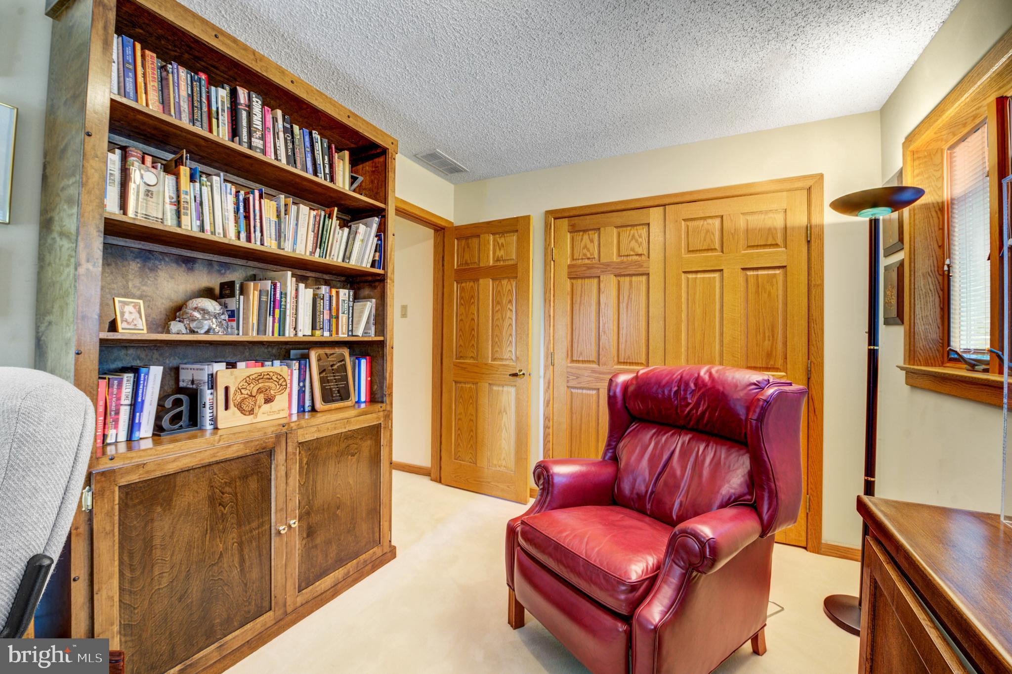 20 Woodbrook Road Voorhees, NJ 08043 - Photo 32 of 46 a book room with furniture and a book shelf