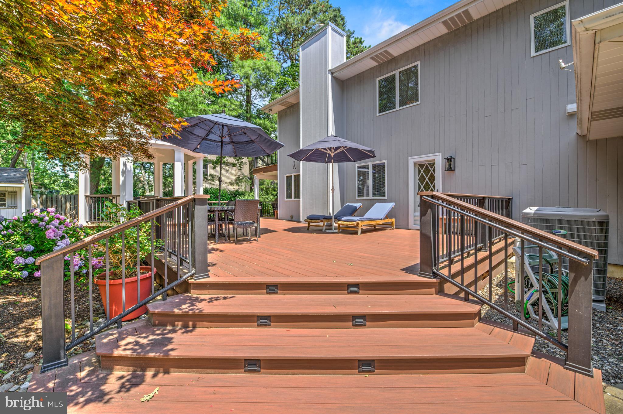 20 Woodbrook Road Voorhees, NJ 08043 - Photo 40 of 46 a view of street with flower on a deck