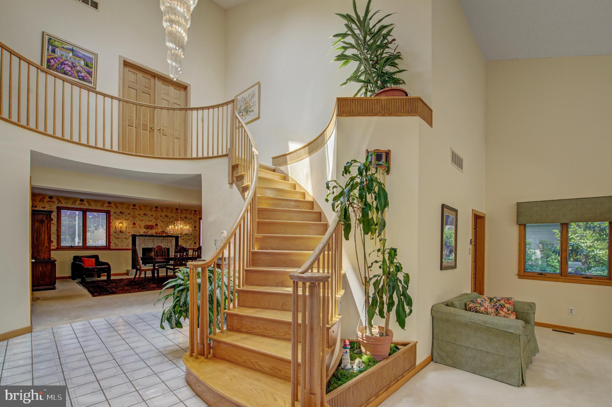 20 Woodbrook Road Voorhees, NJ 08043 - Photo 4 of 46 a view of staircase with furniture and a chandelier