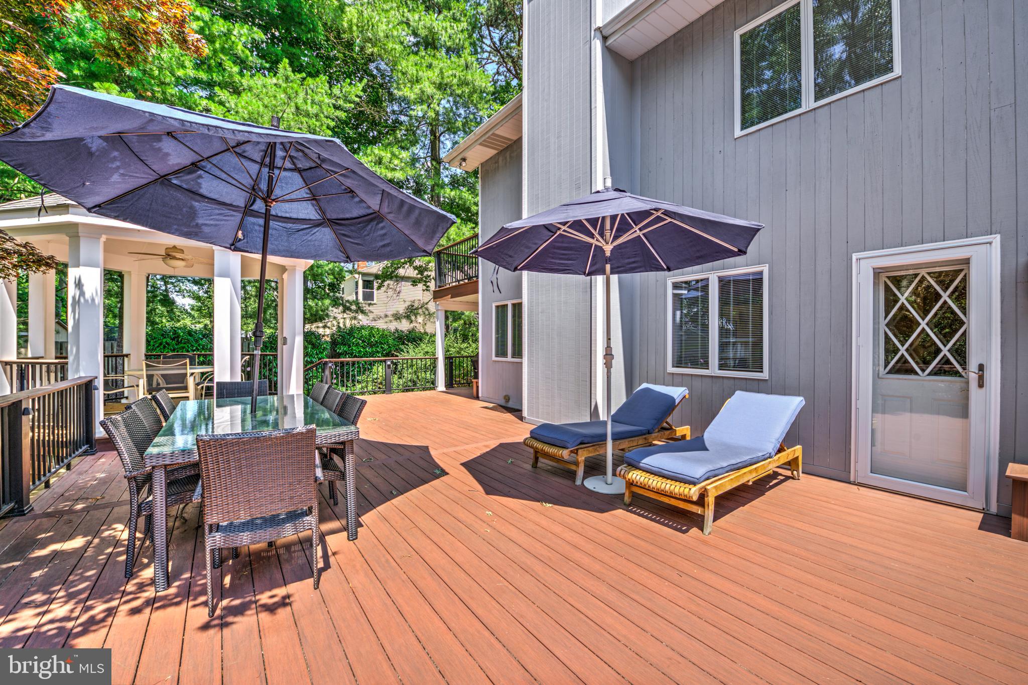20 Woodbrook Road Voorhees, NJ 08043 - Photo 42 of 46 a view of a patio with a table chairs and a umbrella