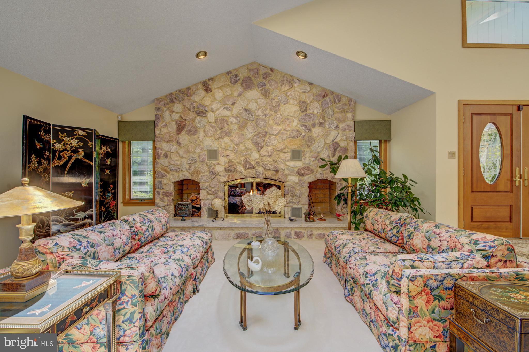 20 Woodbrook Road Voorhees, NJ 08043 - Photo 7 of 46 a living room with a couch and a fireplace