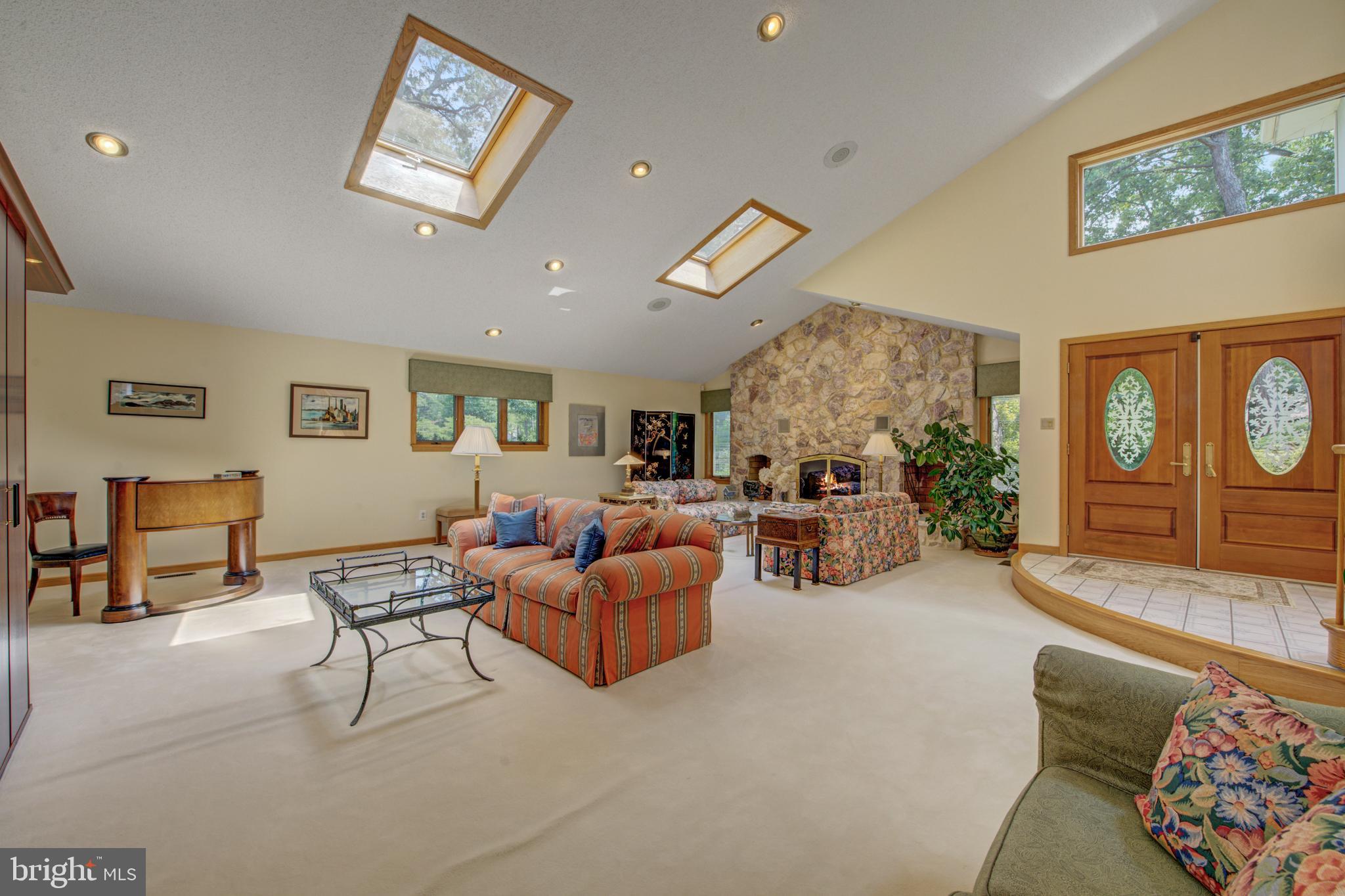 20 Woodbrook Road Voorhees, NJ 08043 - Photo 8 of 46 a living room with furniture and a large window
