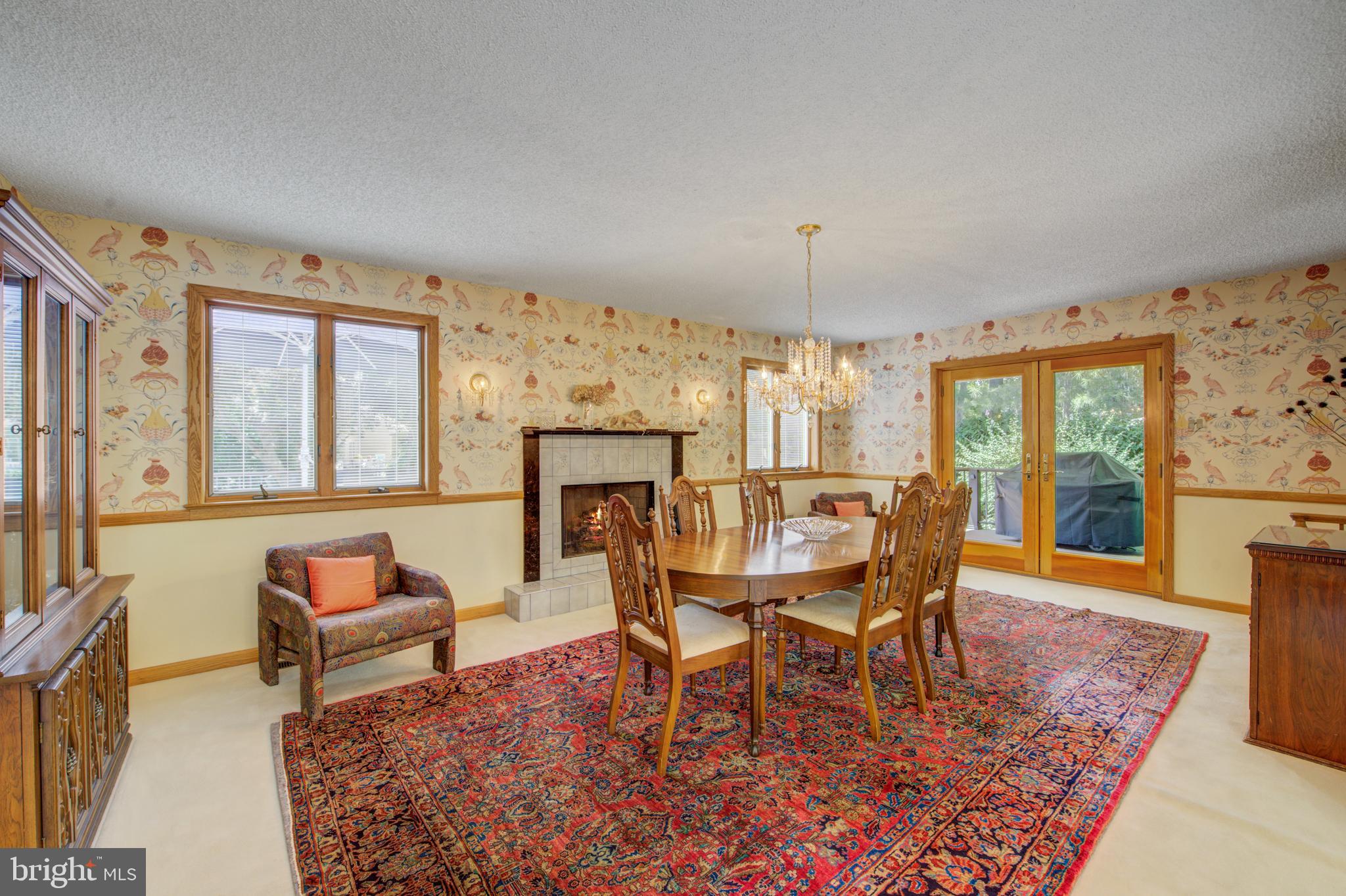 20 Woodbrook Road Voorhees, NJ 08043 - Photo 9 of 46 a dining room with furniture a rug and a fireplace