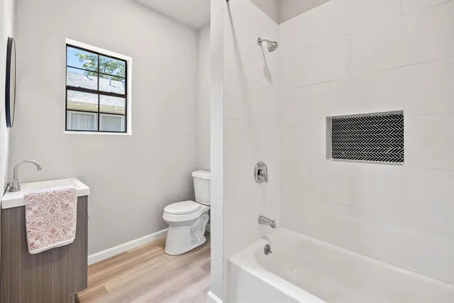 a bathroom with a toilet and a bathtub