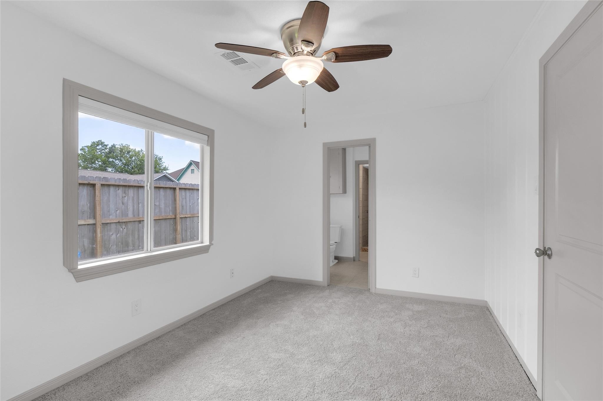 2934 Robertson Street Houston, TX 77009 - Photo 12 of 23 a view of an empty room with a window