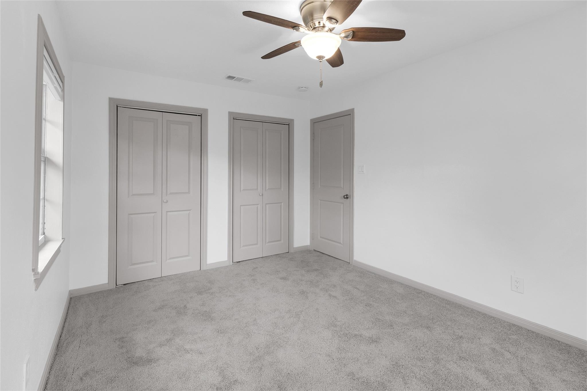 2934 Robertson Street Houston, TX 77009 - Photo 17 of 23 a view of an empty room and chandelier fan