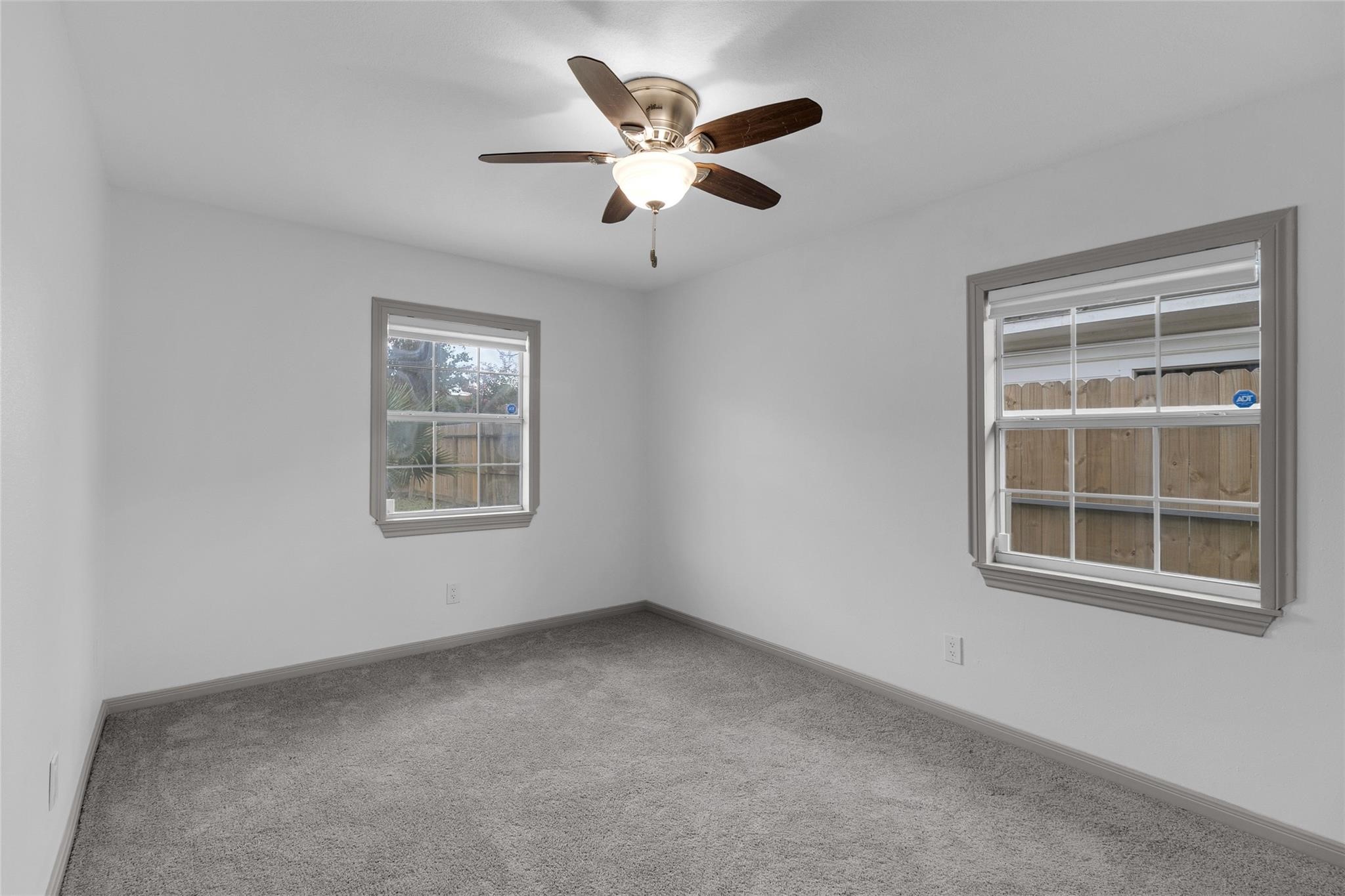 2934 Robertson Street Houston, TX 77009 - Photo 18 of 23 an empty room with windows and ceiling fan