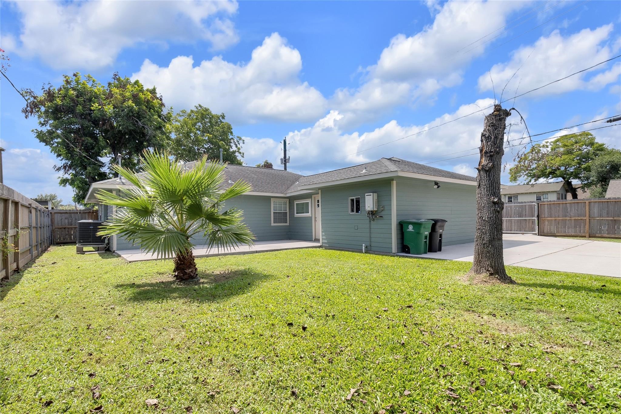2934 Robertson Street Houston, TX 77009 - Photo 19 of 23 a view of a house with a yard and garage