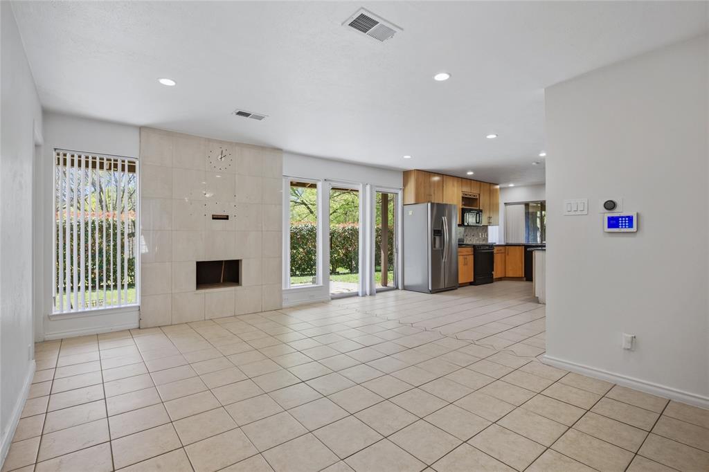 15721 Mapleview Circle Dallas, TX 75248 - Photo 14 of 40 a view of an empty room with a window