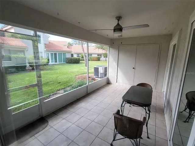 a room with natural light and furniture