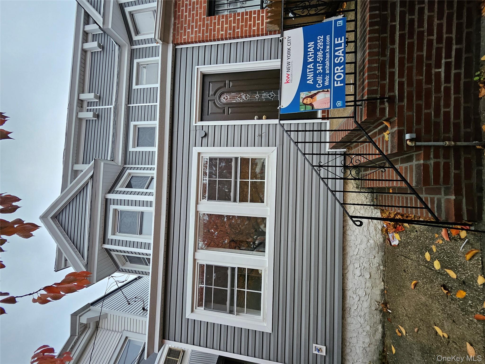 94-19 116th Street Queens, NY 11419 - Photo 2 of 7 a front view of a house with glass windows