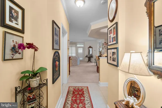 a view of living room with furniture and entryway