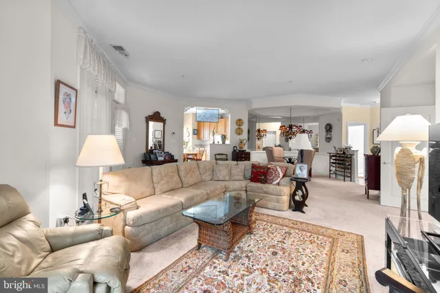 a living room with furniture and a rug
