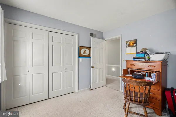 a room with furniture and a closet