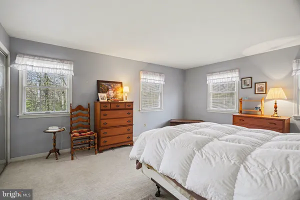 a bedroom with a bed and a tv