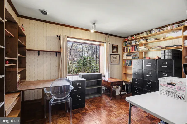 a living room with furniture and large window