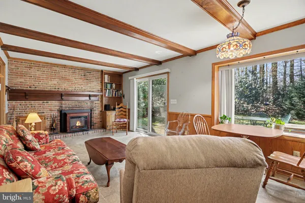 a bedroom with furniture and a fireplace