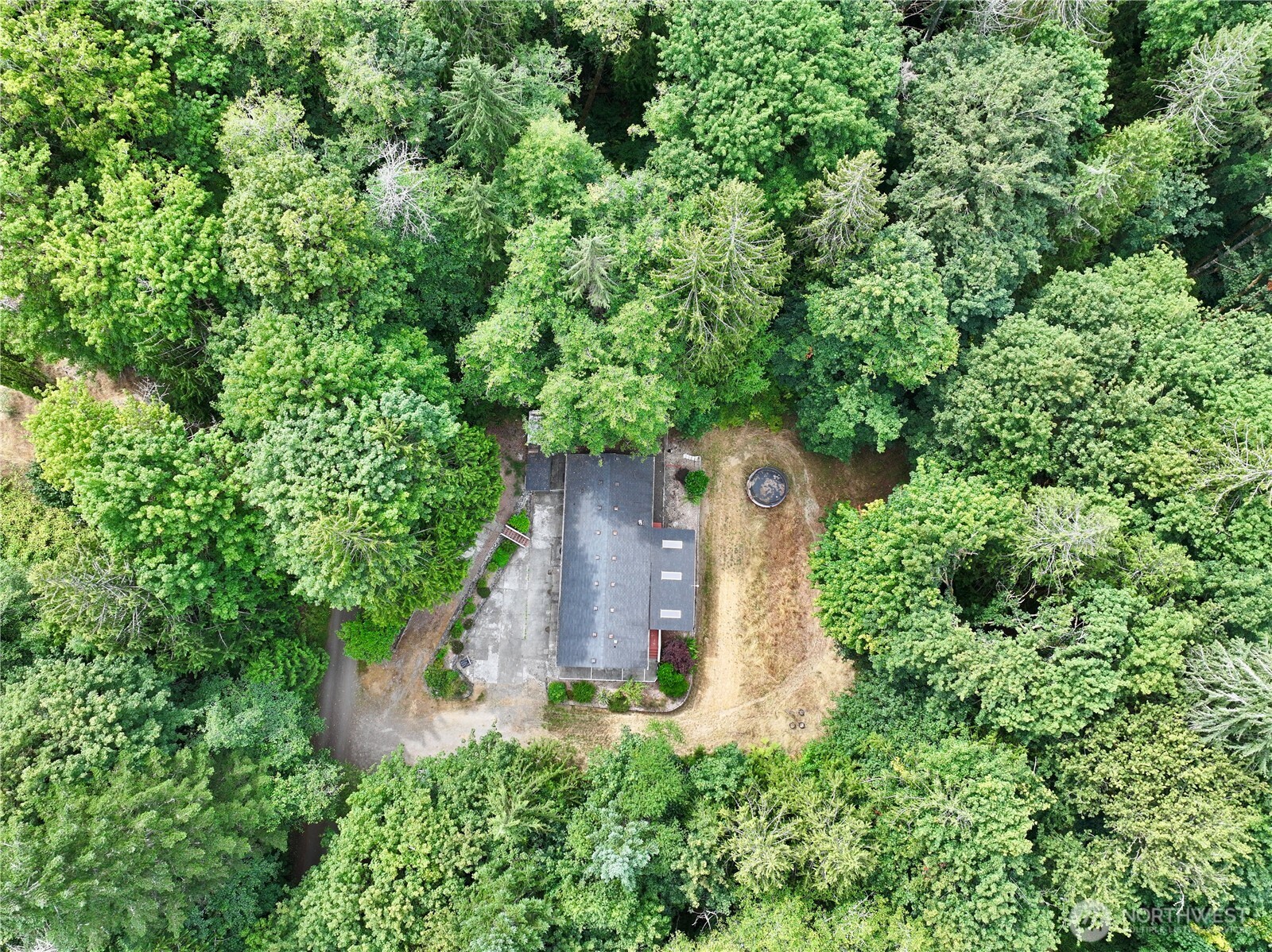 an aerial view of a house with a yard