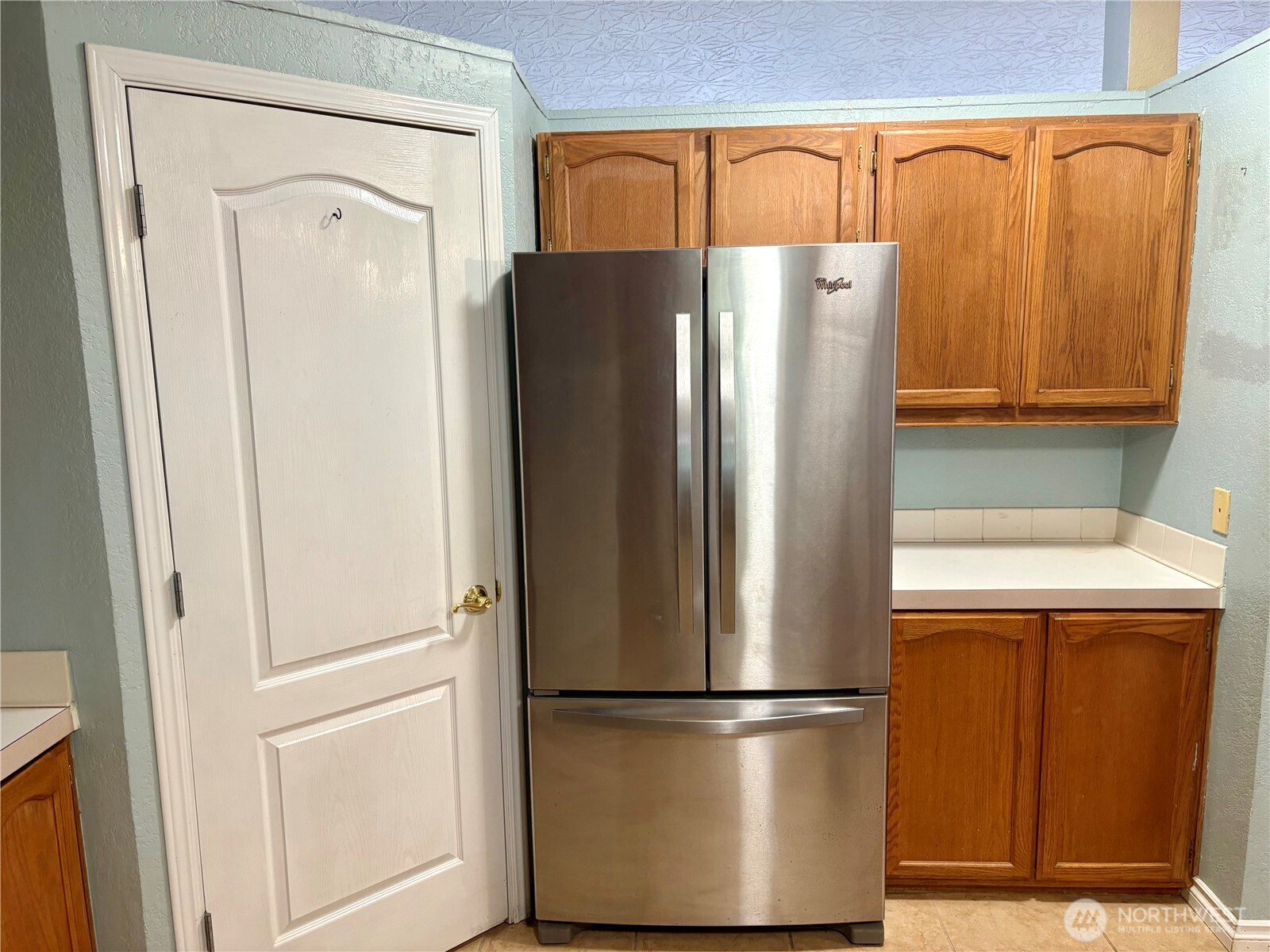17411 64th St Court Northwest Vaughn, WA 98394 - Photo 11 of 27 a white refrigerator freezer sitting in a kitchen