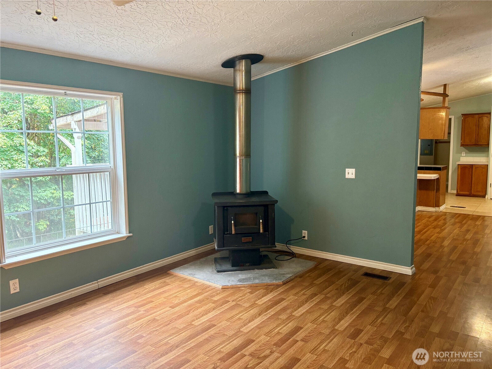 17411 64th St Court Northwest Vaughn, WA 98394 - Photo 12 of 27 a view of a livingroom with wooden floor