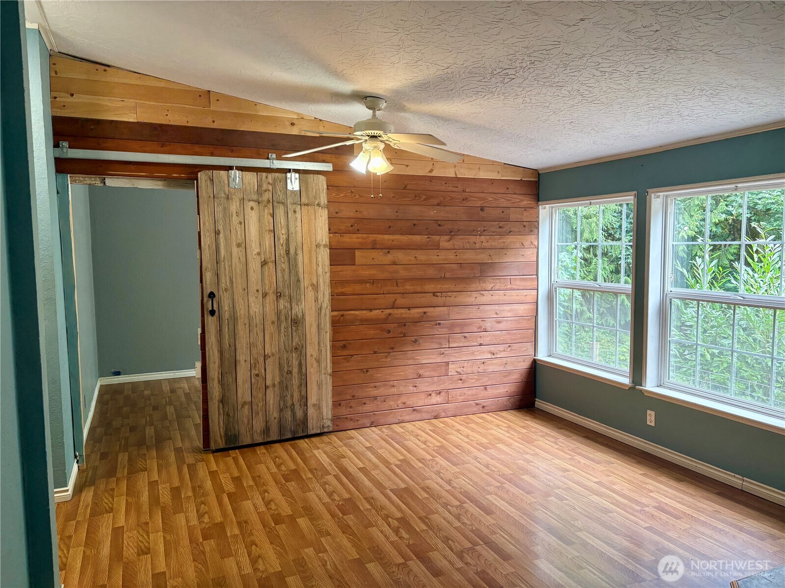 17411 64th St Court Northwest Vaughn, WA 98394 - Photo 13 of 27 a view of an empty room with a window